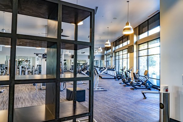 State-of-the-art fitness center featuring modern equipment at The Asher Apartments, managed by Greystar