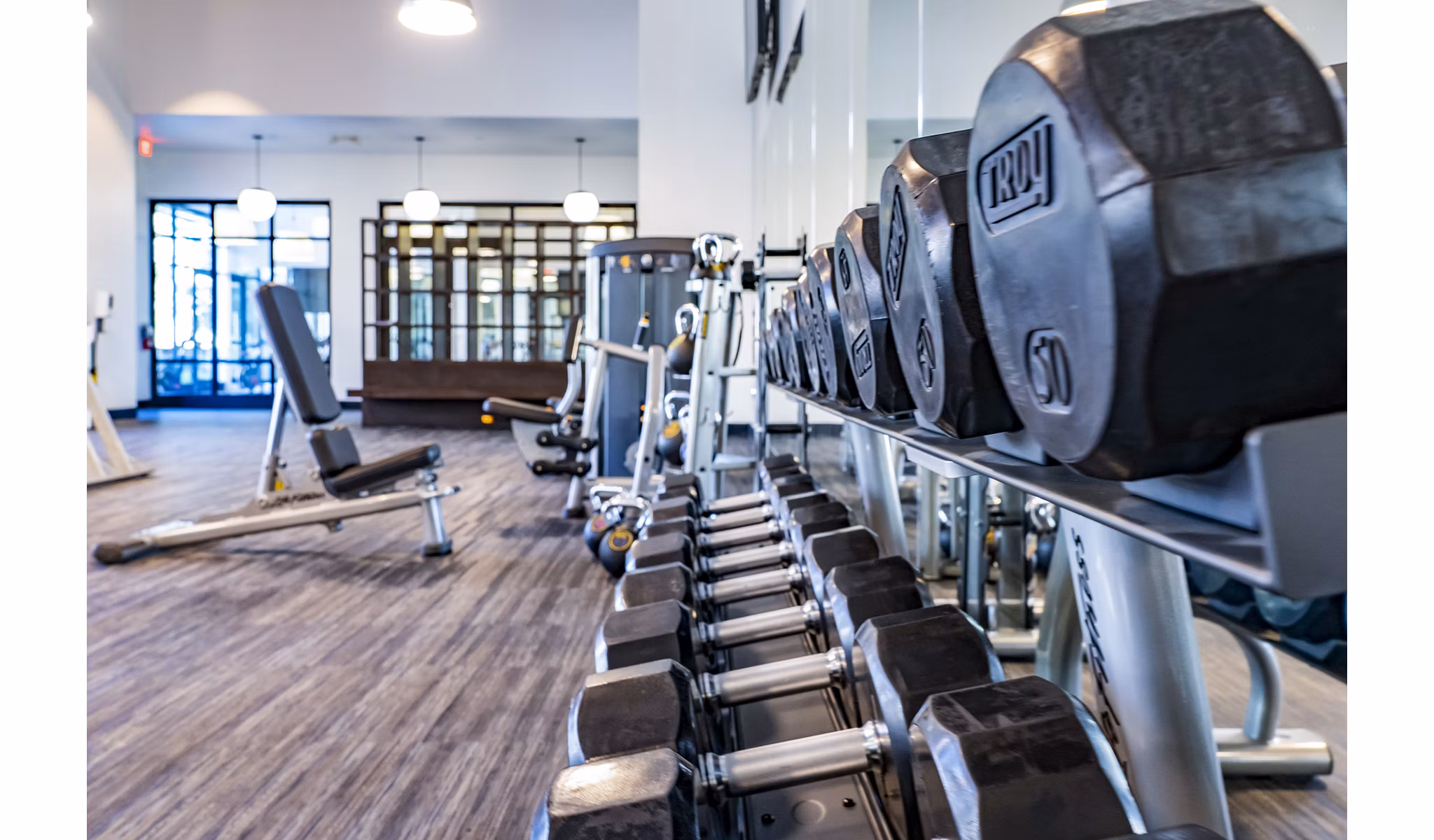 Modern fitness center with state-of-the-art equipment at The Asher Apartments, ideal for active residents seeking luxury living