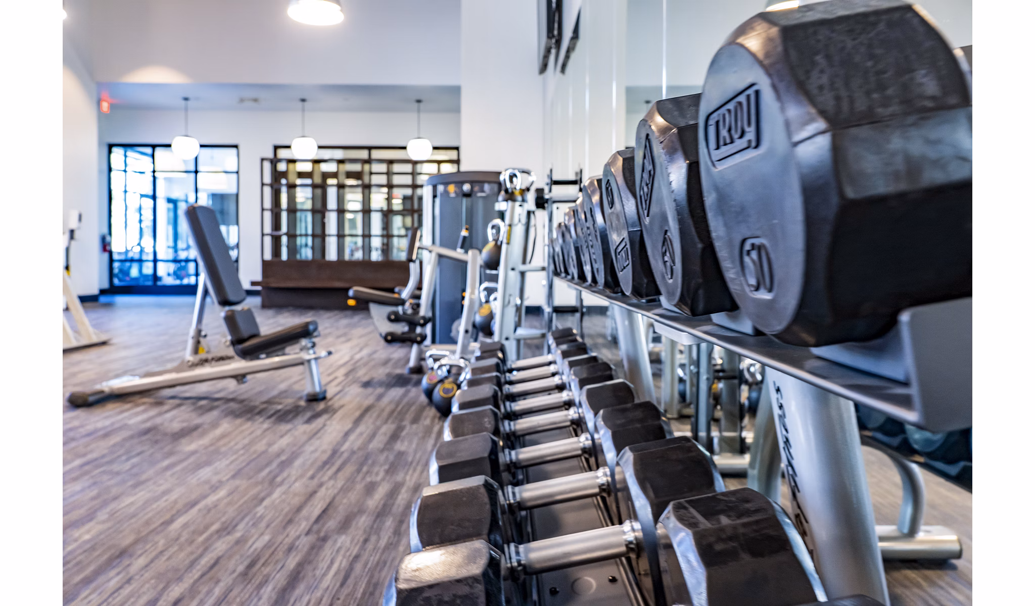 Modern fitness center with state-of-the-art equipment at The Asher Apartments, ideal for active residents seeking luxury living