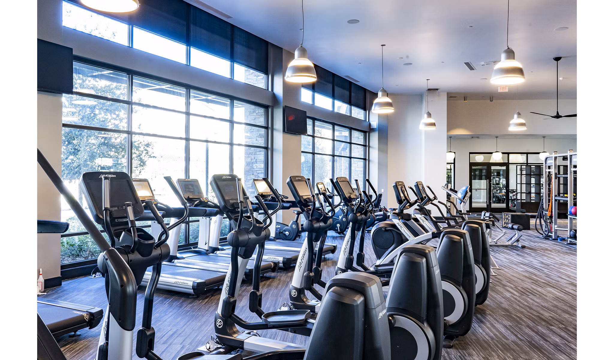 State-of-the-art fitness center with modern equipment at The Asher Apartments, ideal for health and wellness enthusiasts