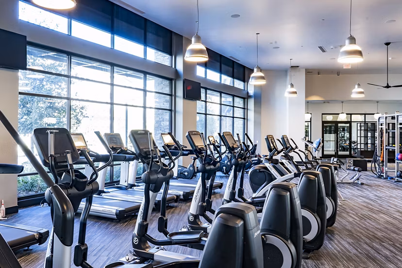 State-of-the-art fitness center with modern equipment at The Asher Apartments, ideal for health and wellness enthusiasts