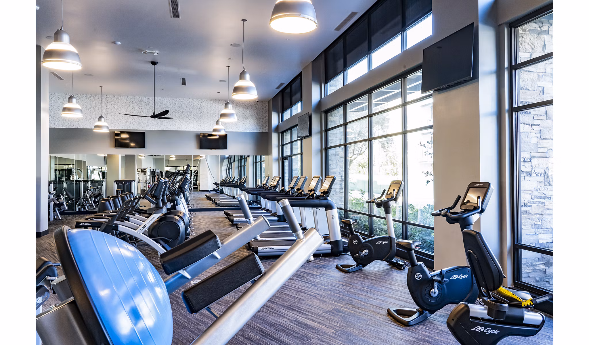 State-of-the-art fitness center with modern equipment at The Asher Apartments