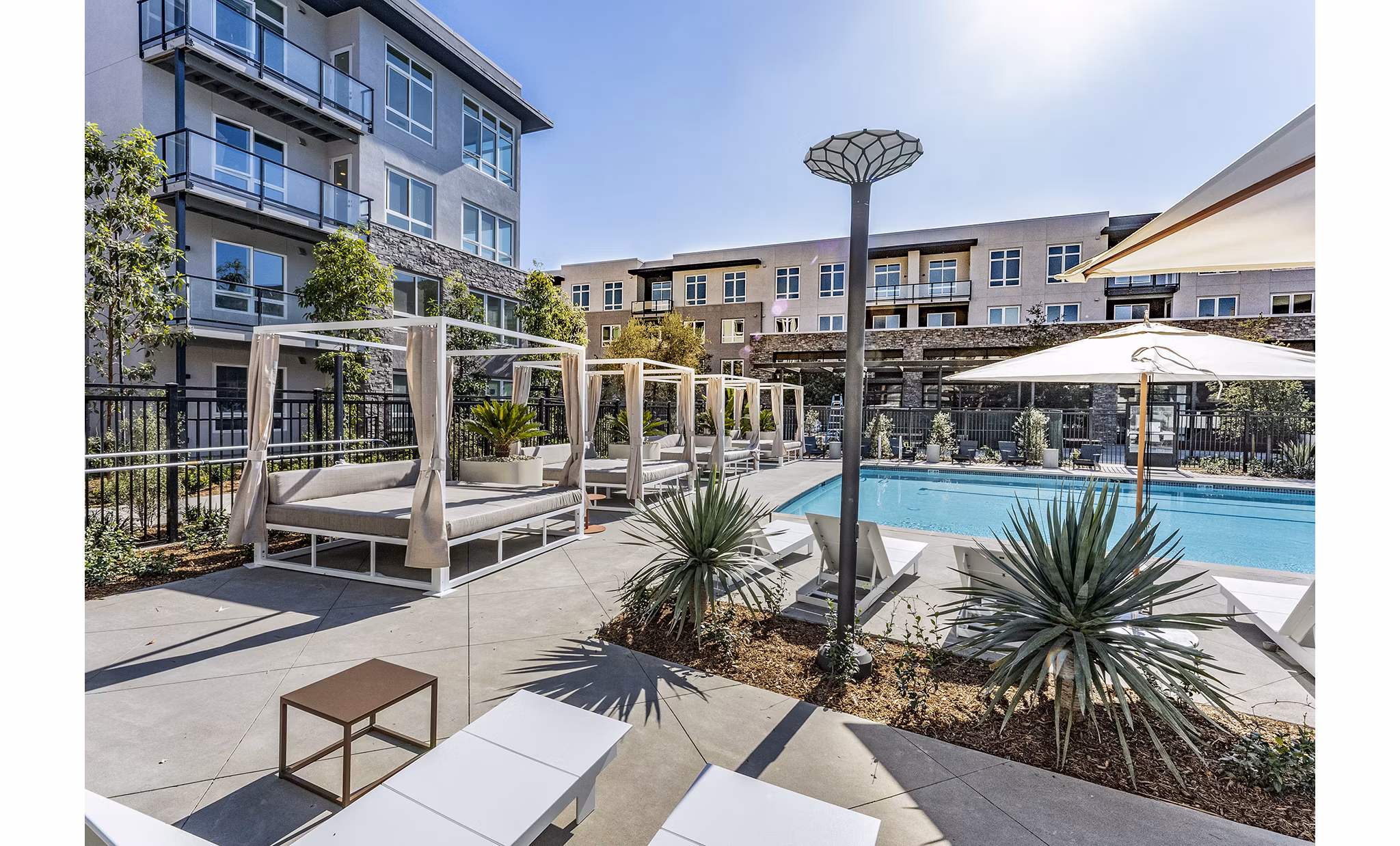 Luxurious rooftop pool at The Asher Apartments offering relaxation and stunning views