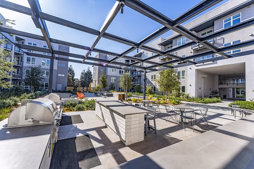Grill area at The Asher Apartments: Outdoor BBQ space with modern facilities and seating perfect for gatherings