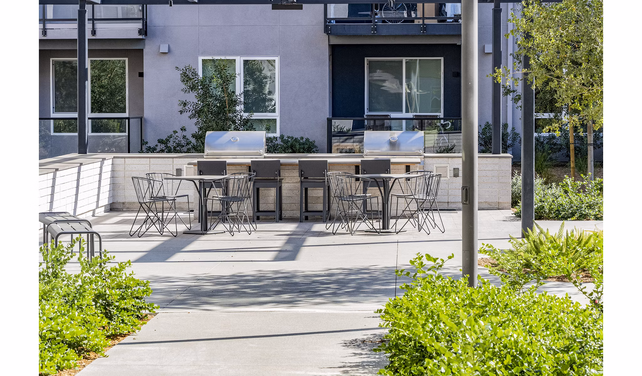 Outdoor grill area with modern setup at The Asher Apartments
