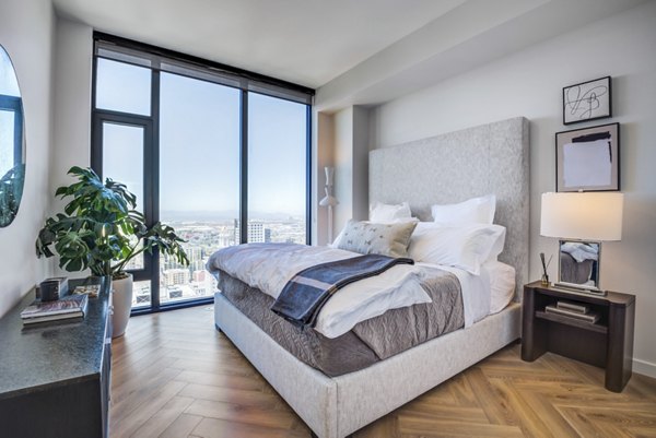 Cozy bedroom with modern decor at Atlas Apartments, luxury living in the heart of downtown, perfect for urban lifestyle enthusiasts