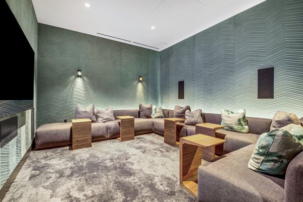 Theater featuring plush seating and large screens at Atlas Apartments