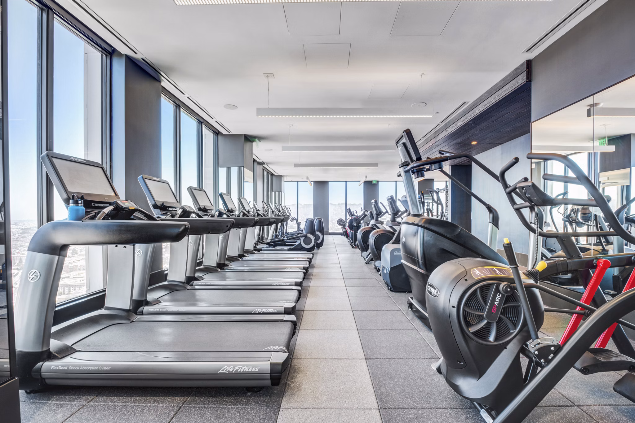 State-of-the-art fitness center at Atlas Apartments with modern equipment and spacious workout areas