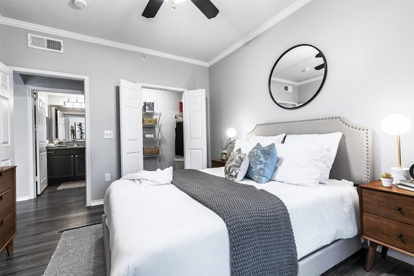 Cozy bedroom with natural light and modern decor at Mesa Verde Apartments