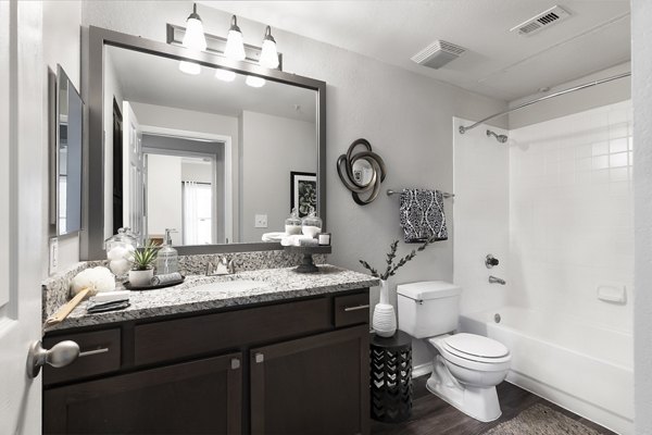 Luxurious bathroom with modern fixtures at Mesa Verde Apartments, offering elegant space and functionality for residents