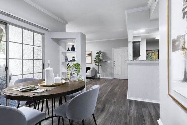 Dining area with modern decor and ample seating at Mesa Verde Apartments, Greystar luxury apartments in a vibrant community