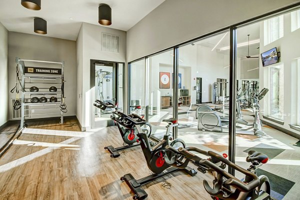 Yoga/spin studio with state-of-the-art equipment at Lenox Reserve Apartments, promoting health and wellness