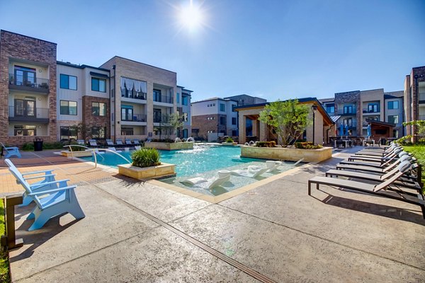 Resort-style pool at Lenox Reserve Apartments offering luxury relaxation in a beautifully landscaped setting