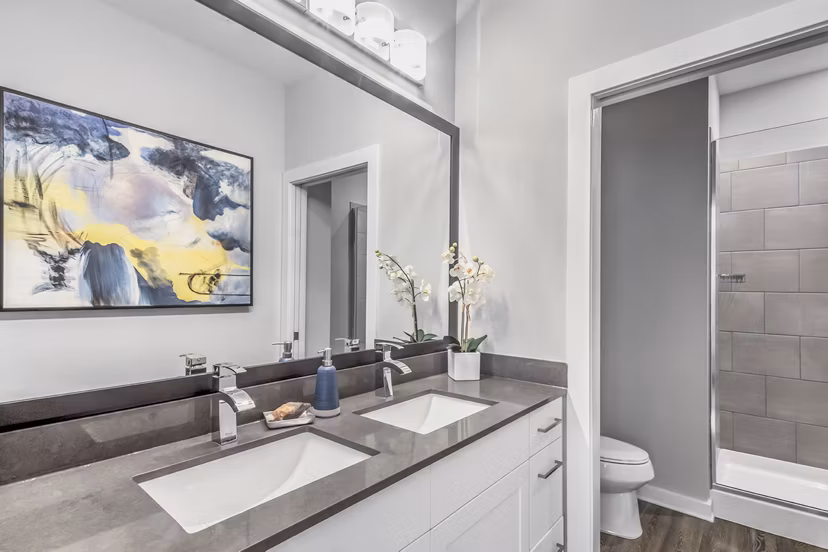 Bainbridge South End Apartments: Modern bathroom with sleek fixtures and neutral tones
