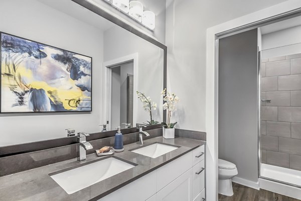 Bainbridge South End Apartments: Modern bathroom with sleek fixtures and neutral tones