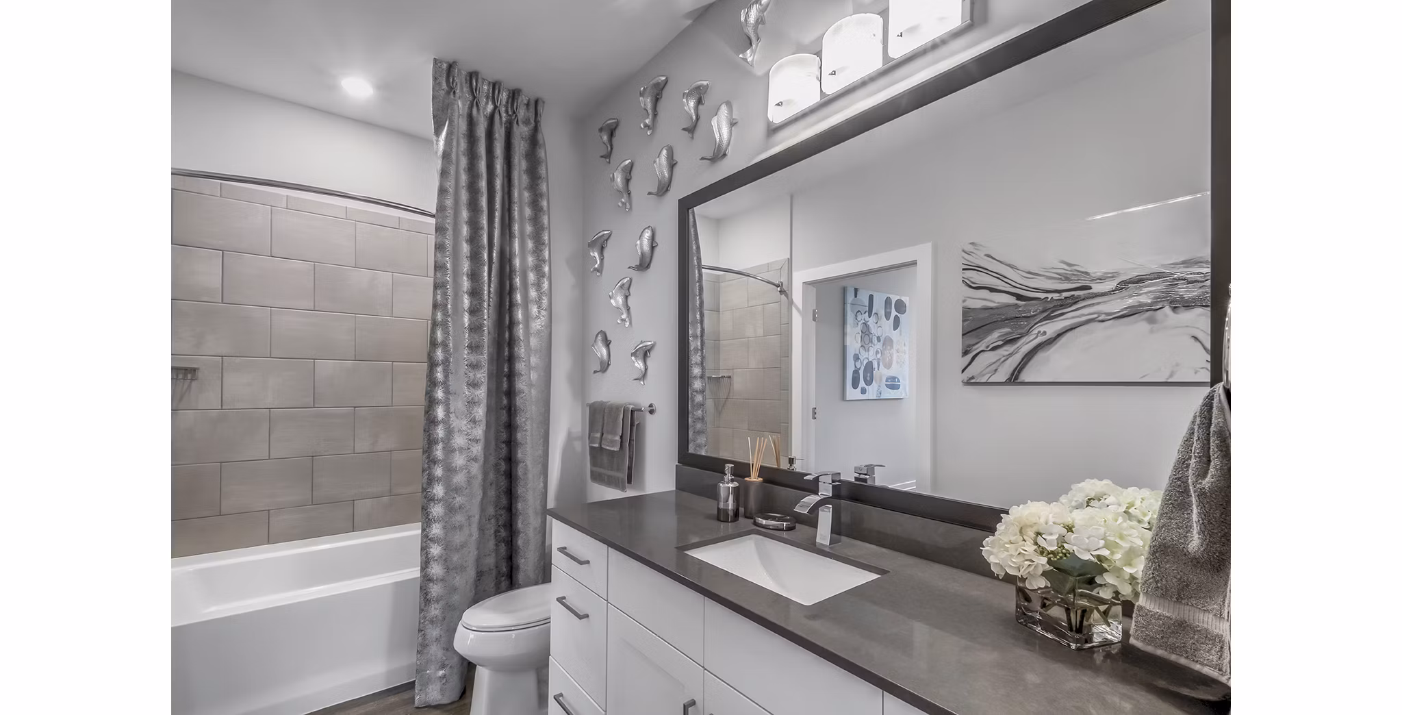 Bathroom with modern fixtures and elegant design at Bainbridge South End Apartments; featuring spacious layout and luxurious finishes for a relaxing experience