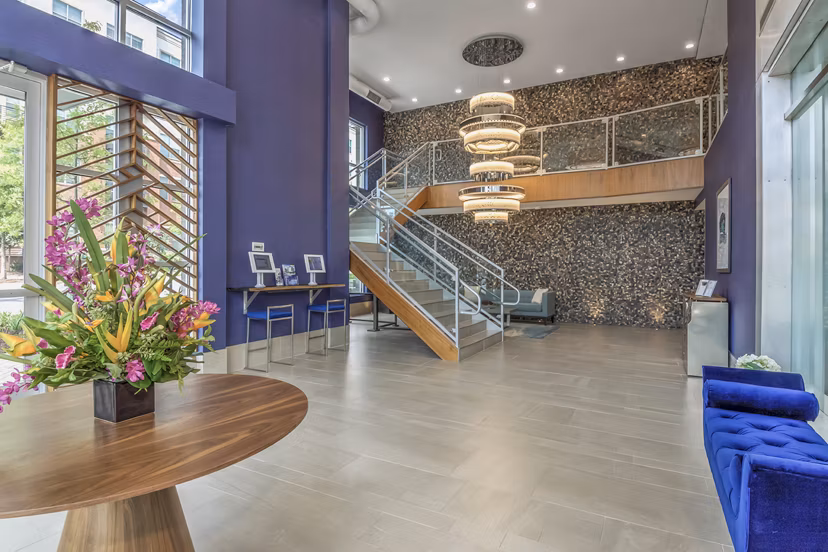 Spacious clubhouse with modern furnishings at Bainbridge South End Apartments, ideal for community events and gatherings