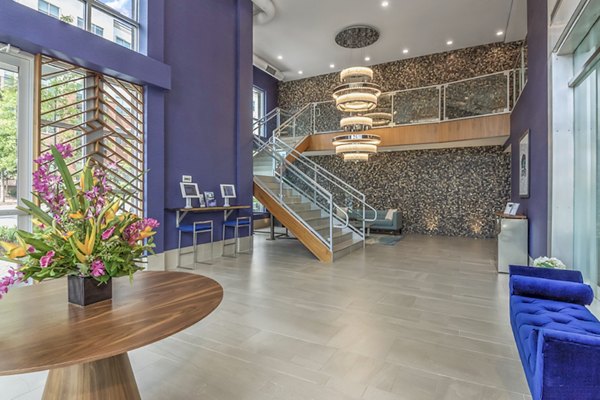 Spacious clubhouse with modern furnishings at Bainbridge South End Apartments, ideal for community events and gatherings