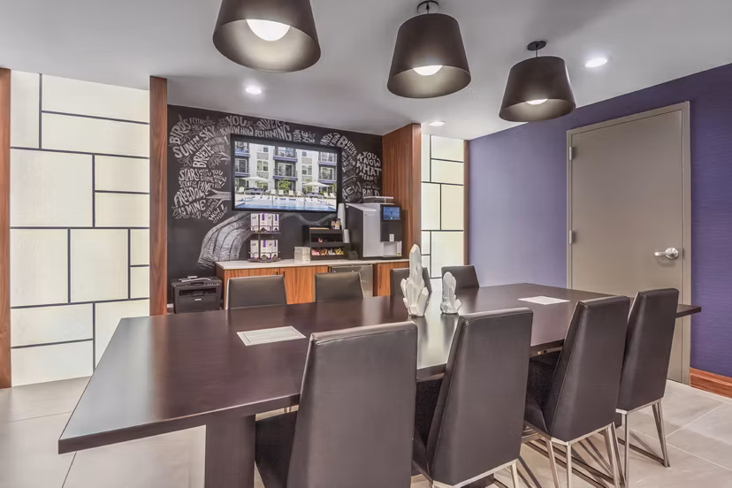 Meeting room with modern design and tech amenities in Bainbridge South End Apartments Perfect space for conferences and gatherings