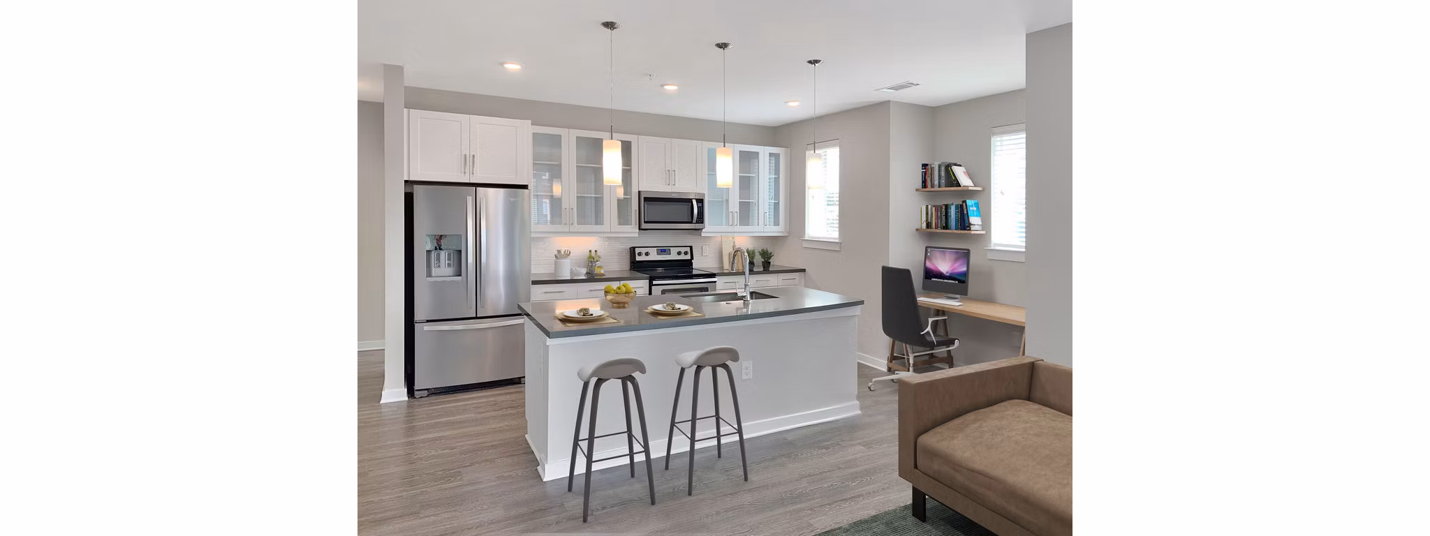 Modern kitchen with stainless steel appliances at Maddox South End Apartments