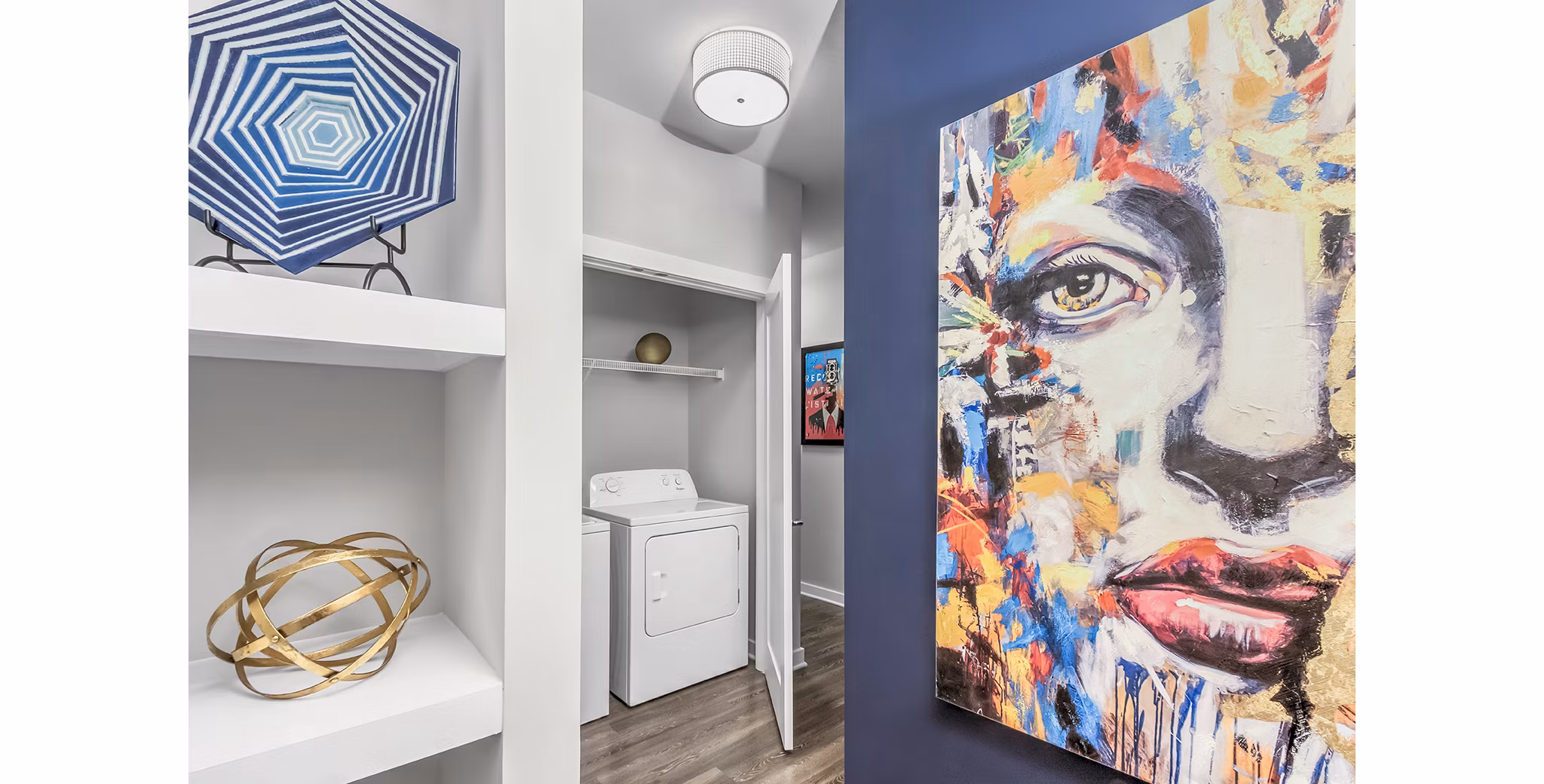 Laundry room featuring modern appliances at Bainbridge South End Apartments