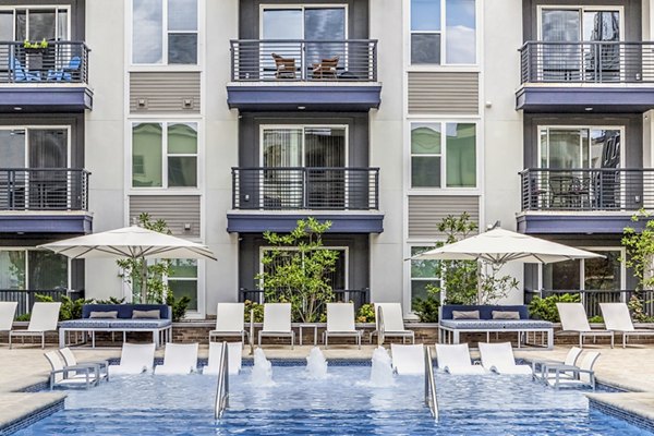 Rooftop pool with skyline views at Bainbridge South End Apartments, luxury living near  training hubs