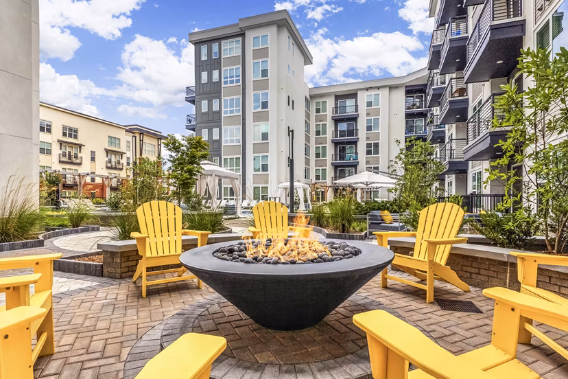 Cozy fire pit area at Bainbridge South End Apartments, ideal for outdoor relaxation and social gatherings