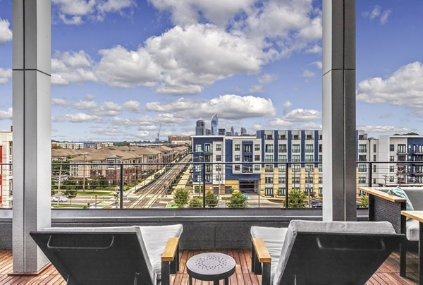 Spacious rooftop deck at Bainbridge South End Apartments with city views, perfect for relaxation and gatherings