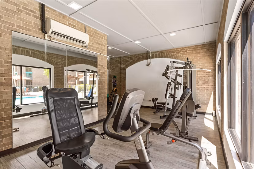 Fitness center equipped with modern machines at The Haven Apartments