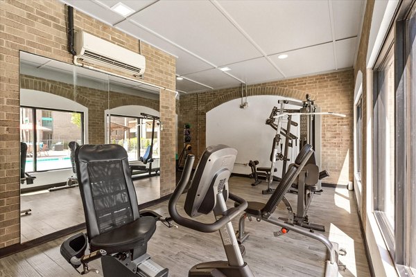 Fitness center equipped with modern machines at The Haven Apartments