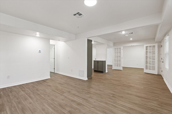 Open concept kitchen with modern appliances and sleek cabinetry in The Haven Apartments