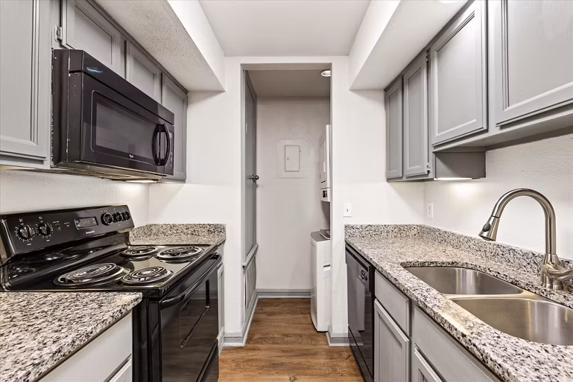 Modern kitchen with stainless steel appliances at The Haven Apartments, Greystar luxury apartments