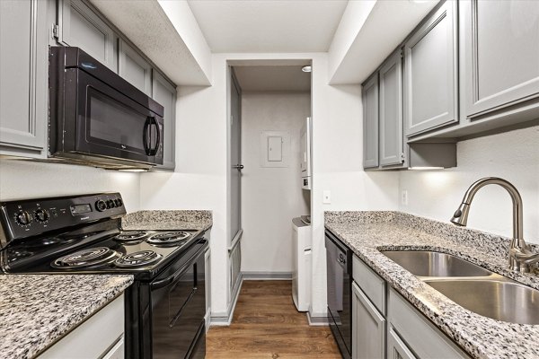 Modern kitchen with stainless steel appliances at The Haven Apartments, Greystar luxury apartments