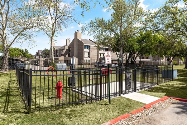 Dog park with agility equipment at The Haven Apartments, a luxury  community