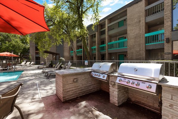 Outdoor grilling area with modern BBQ stations at The Haven Apartments, perfect for social gatherings and culinary enthusiasts