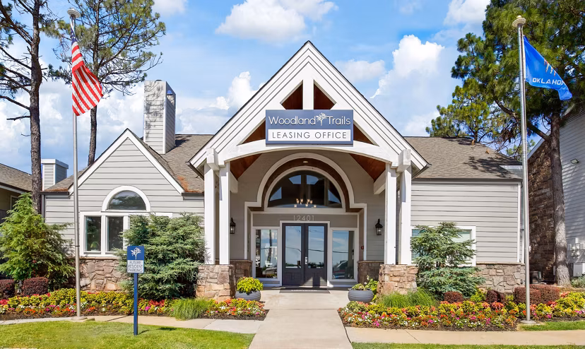 Woodland Trails Apartments: Stunning of luxury apartment complex surrounded by lush greenery in a serene setting