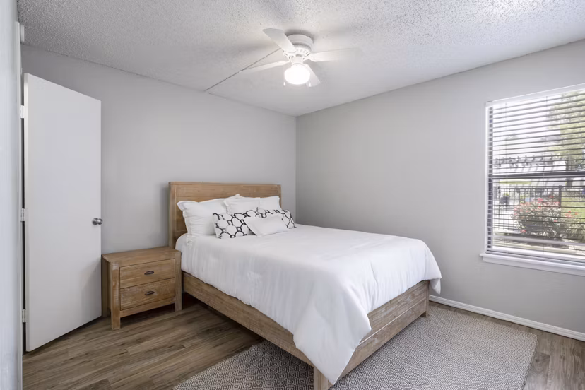 Spacious bedroom with elegant decor at Woodland Trails Apartments