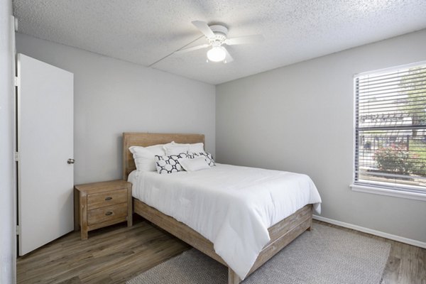 Spacious bedroom with elegant decor at Woodland Trails Apartments