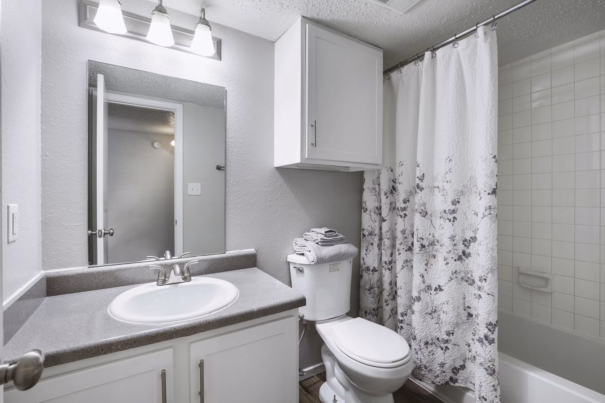 Bathroom at Woodland Trails Apartments featuring modern fixtures and elegant design