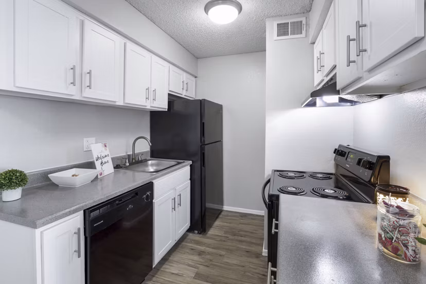 Modern clubhouse with cozy seating and entertainment options at Woodland Trails Apartments