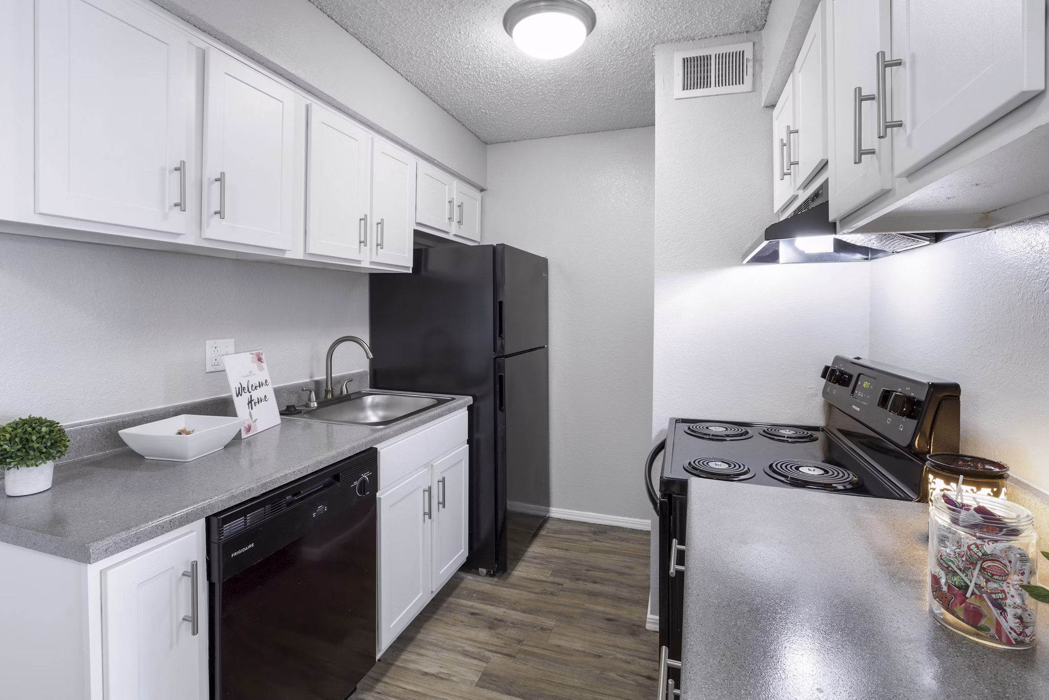 Modern clubhouse with cozy seating and entertainment options at Woodland Trails Apartments