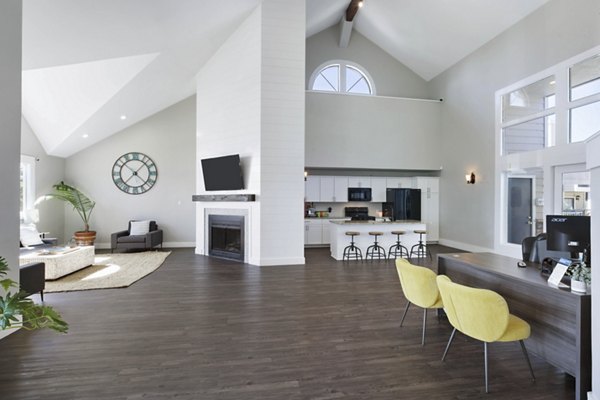 Clubhouse featuring cozy seating and modern design at Woodland Trails Apartments