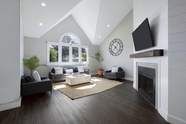 Clubhouse featuring modern design and comfortable seating at Woodland Trails Apartments