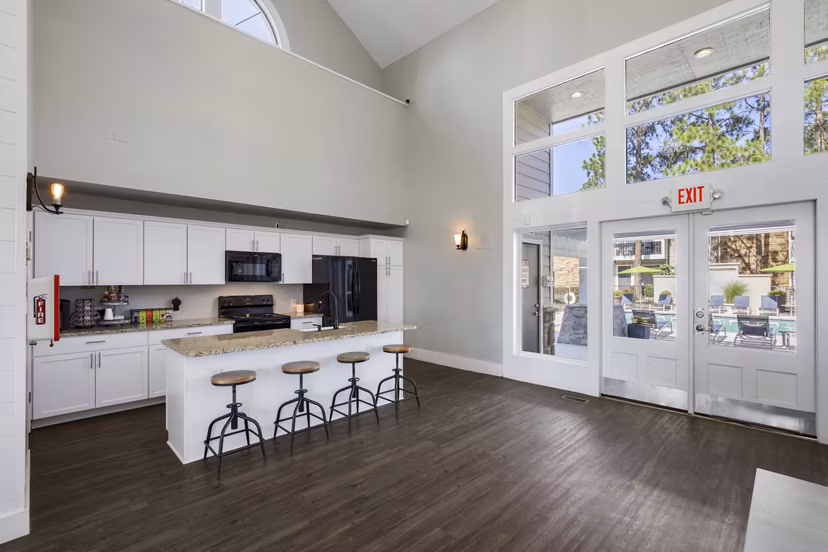 Stylish clubhouse with modern furnishings at Woodland Trails Apartments