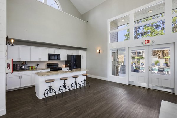 Stylish clubhouse with modern furnishings at Woodland Trails Apartments