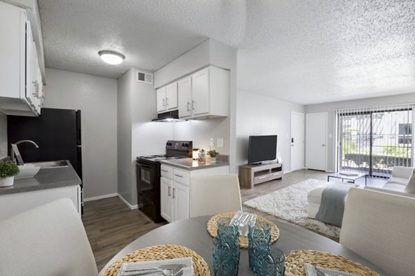 Dining area with modern furnishings and natural light at Woodland Trails Apartments