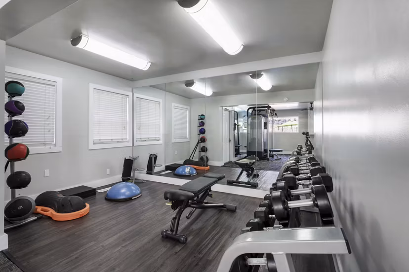 State-of-the-art fitness center at Woodland Trails Apartments with modern equipment and spacious workout areas