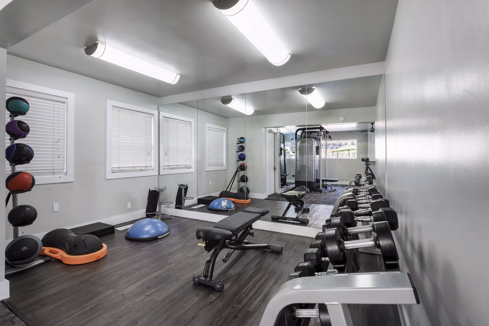 State-of-the-art fitness center at Woodland Trails Apartments with modern equipment and spacious workout areas