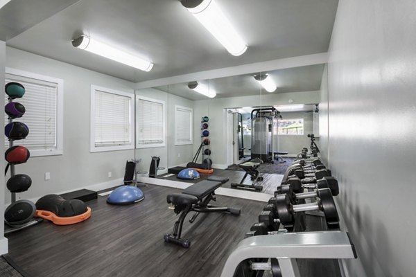 State-of-the-art fitness center at Woodland Trails Apartments with modern equipment and spacious workout areas