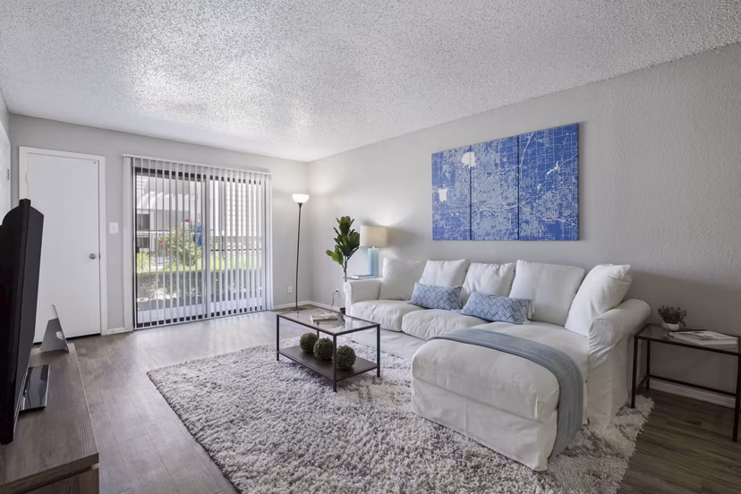 Spacious living room with modern decor at Woodland Trails Apartments